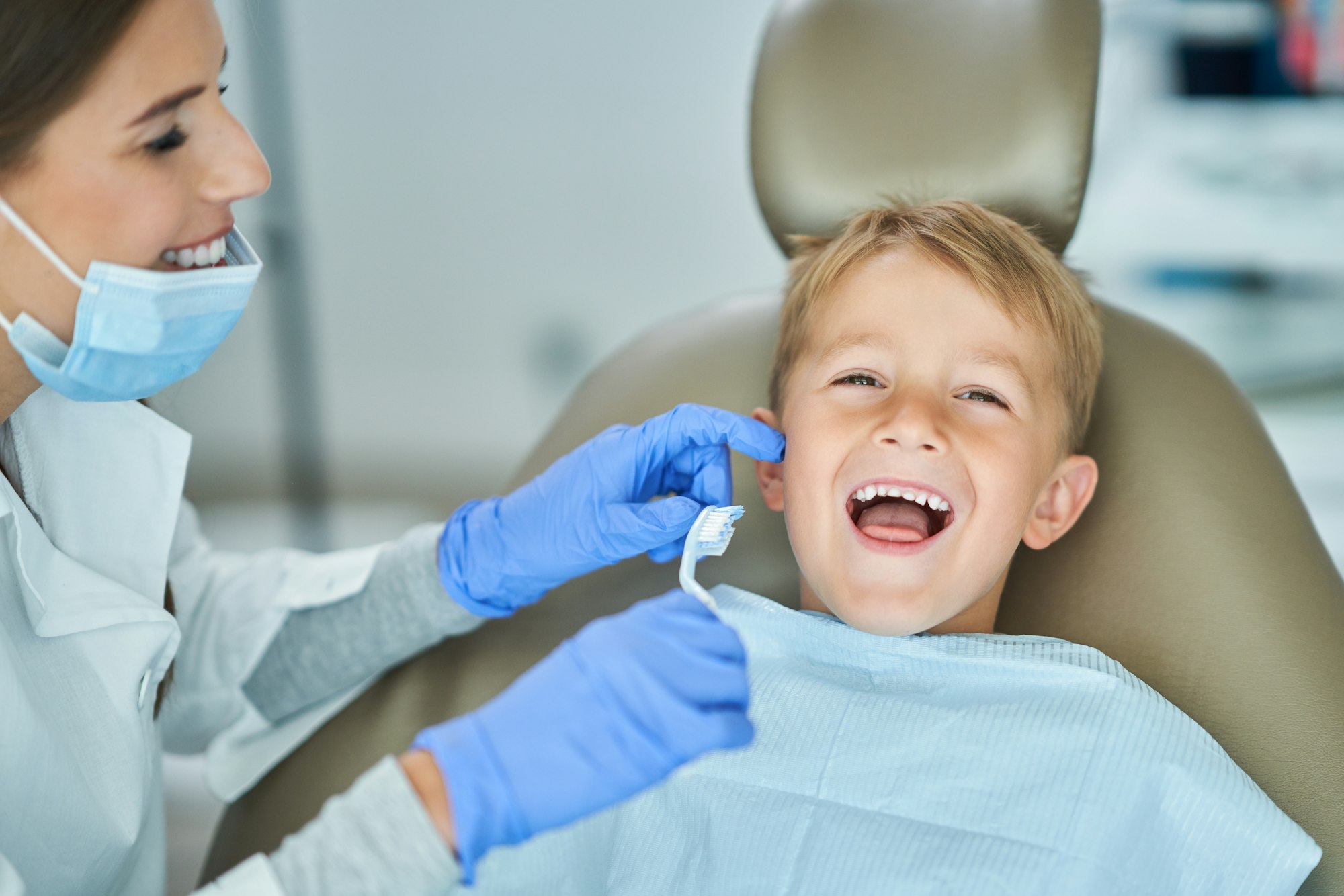 Little boy and female dentist in the dentists office